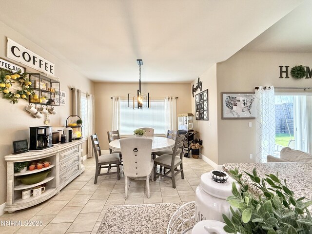 3221 Hackamore Way, Winnemucca, NV 89445 - dining space with light tile patterned floors, plenty of natural light, a chandelier, and baseboards