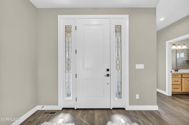 3952 Siena Dr, Carson City, NV 89703 - entrance foyer featuring baseboards, wood finished floors, and recessed lighting