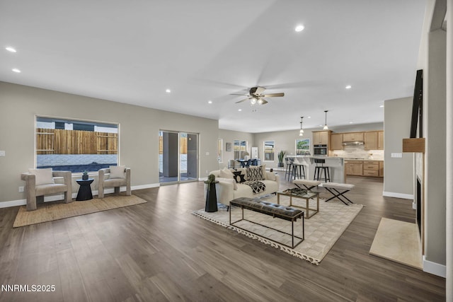 3952 Siena Dr, Carson City, NV 89703 - living room with a ceiling fan, baseboards, recessed lighting, and dark wood-type flooring