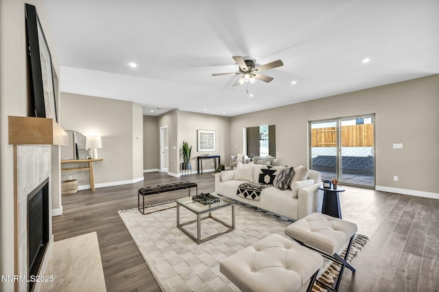 3952 Siena Dr, Carson City, NV 89703 - living area featuring a ceiling fan, baseboards, wood finished floors, recessed lighting, and a fireplace