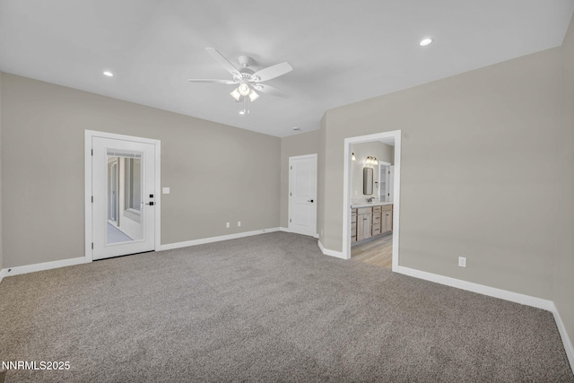 3952 Siena Dr, Carson City, NV 89703 - unfurnished bedroom with light carpet, baseboards, recessed lighting, connected bathroom, and a ceiling fan