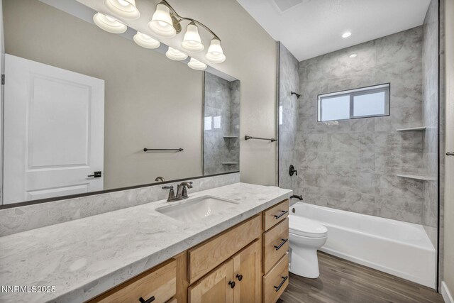 3952 Siena Dr, Carson City, NV 89703 - bathroom featuring vanity, toilet, bathing tub / shower combination, and wood finished floors