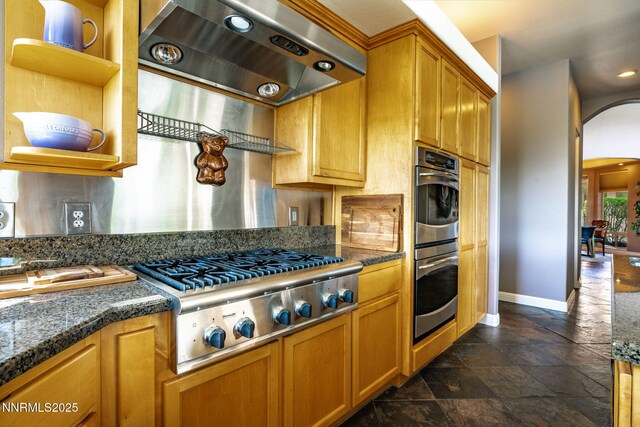 2473 Genoa Aspen Dr, Genoa, NV 89411 - kitchen featuring appliances with stainless steel finishes, range hood, open shelves, arched walkways, and baseboards