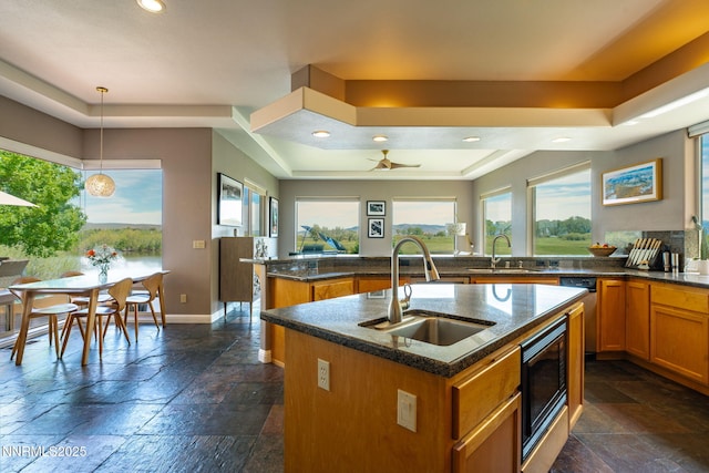 2473 Genoa Aspen Dr, Genoa, NV 89411 - kitchen featuring a raised ceiling, a sink, stone tile flooring, and recessed lighting