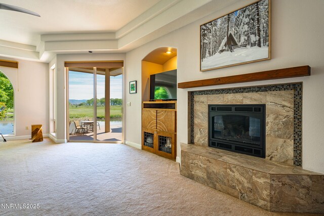 2473 Genoa Aspen Dr, Genoa, NV 89411 - carpeted living room featuring a fireplace and baseboards