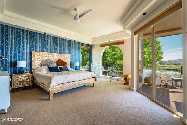 2473 Genoa Aspen Dr, Genoa, NV 89411 - carpeted bedroom with access to exterior, a water view, and ceiling fan