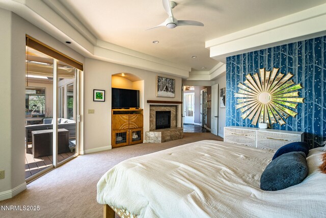 2473 Genoa Aspen Dr, Genoa, NV 89411 - carpeted bedroom with baseboards, access to outside, and a fireplace with raised hearth