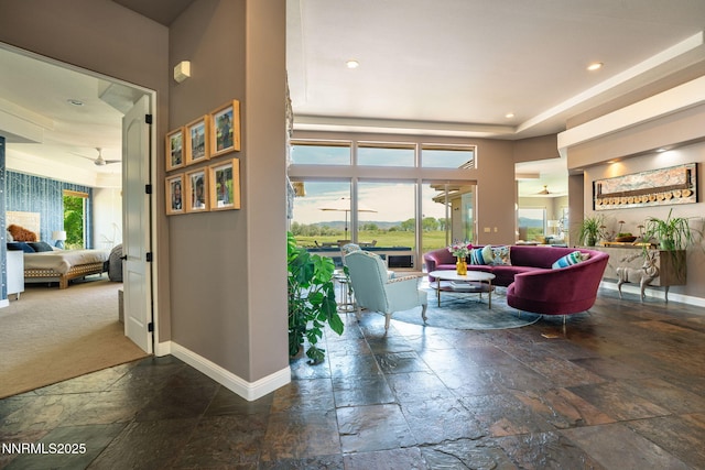 2473 Genoa Aspen Dr, Genoa, NV 89411 - living room featuring stone tile floors, baseboards, and recessed lighting