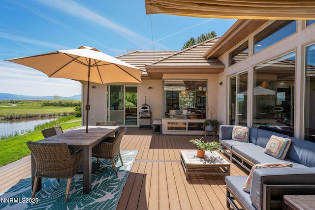 2473 Genoa Aspen Dr, Genoa, NV 89411 - wooden deck featuring outdoor lounge area, a water view, and outdoor dining area