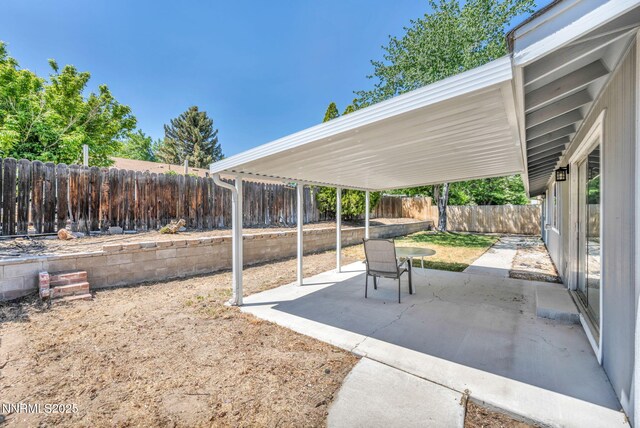 1129 Sonoma St, Carson City, NV 89701 - fenced backyard featuring a patio area