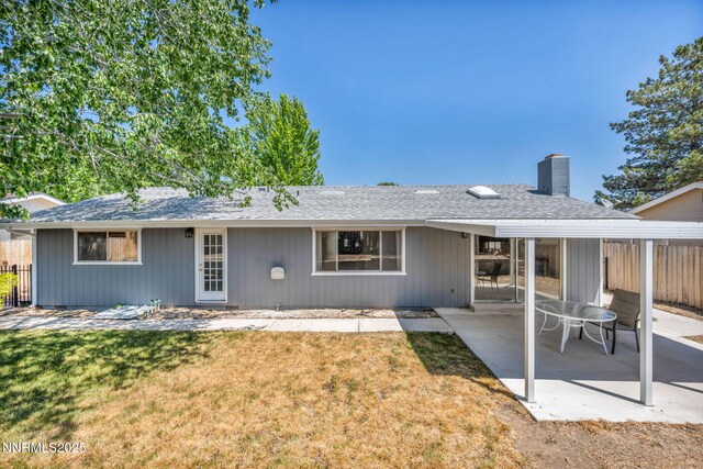 1129 Sonoma St, Carson City, NV 89701 - rear view of property with a chimney, a patio area, and a shingled roof