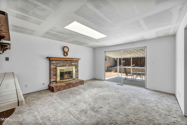 1129 Sonoma St, Carson City, NV 89701 - unfurnished living room featuring carpet floors, a brick fireplace, and a skylight