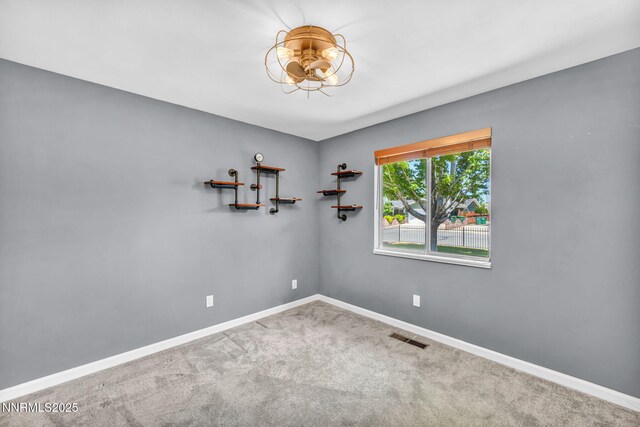 1129 Sonoma St, Carson City, NV 89701 - carpeted spare room featuring baseboards