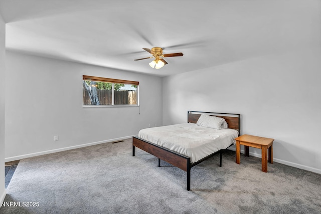 1129 Sonoma St, Carson City, NV 89701 - carpeted bedroom with baseboards and a ceiling fan