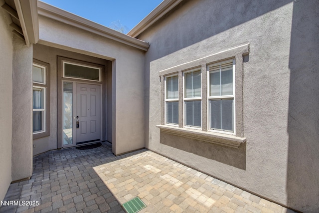 8355 Opal Ranch Way, Reno, NV 89506 - property entrance with stucco siding and a patio