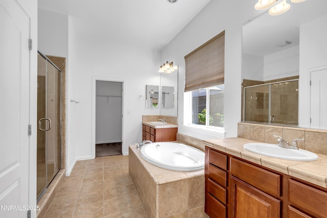 8355 Opal Ranch Way, Reno, NV 89506 - bathroom featuring a stall shower, two vanities, and a garden tub