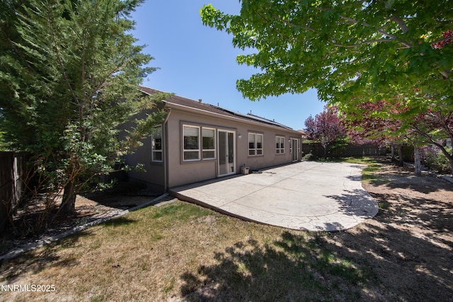 8355 Opal Ranch Way, Reno, NV 89506 - rear view of property with stucco siding, a patio, and a fenced backyard