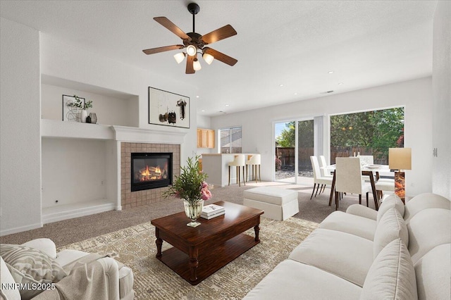 10548 Bliss Ct, Reno, NV 89521 - living room featuring carpet flooring, ceiling fan, and a fireplace