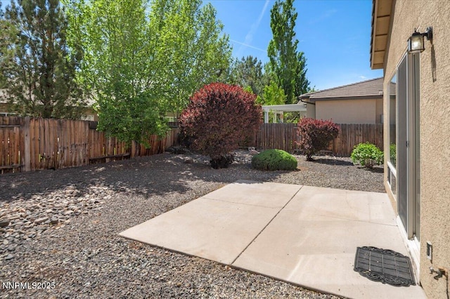 10548 Bliss Ct, Reno, NV 89521 - fenced backyard featuring a patio area