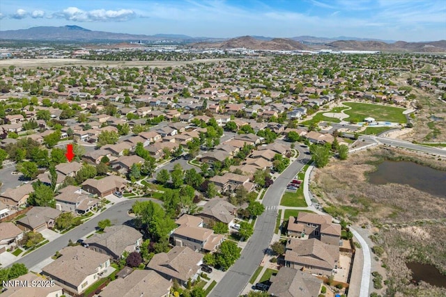 10548 Bliss Ct, Reno, NV 89521 - aerial overview of property's location with a mountain backdrop and nearby suburban area