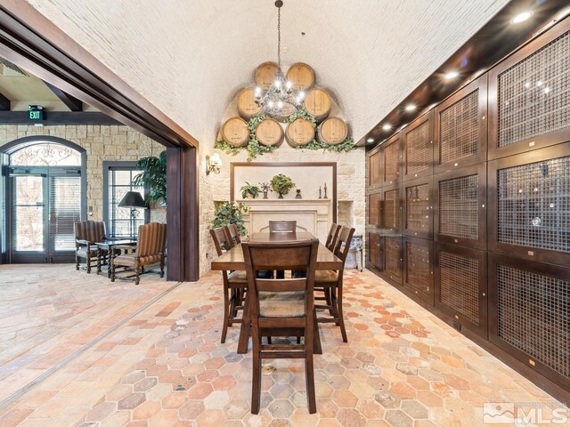 9900 Wilbur May Pkwy Apt 2801, Reno, NV 89521 - dining room featuring a chandelier, light stone finish flooring, vaulted ceiling, and recessed lighting
