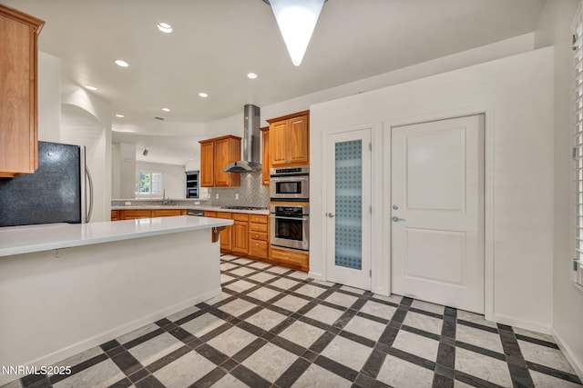 9900 Wilbur May Pkwy Apt 2801, Reno, NV 89521 - kitchen featuring wall chimney exhaust hood, inlaid floor details, freestanding refrigerator, light countertops, and recessed lighting