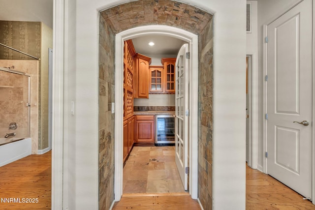 9900 Wilbur May Pkwy Apt 2801, Reno, NV 89521 - corridor featuring beverage cooler, arched walkways, and recessed lighting