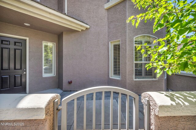 9900 Wilbur May Pkwy Apt 2801, Reno, NV 89521 - entrance to property featuring stucco siding and a gate