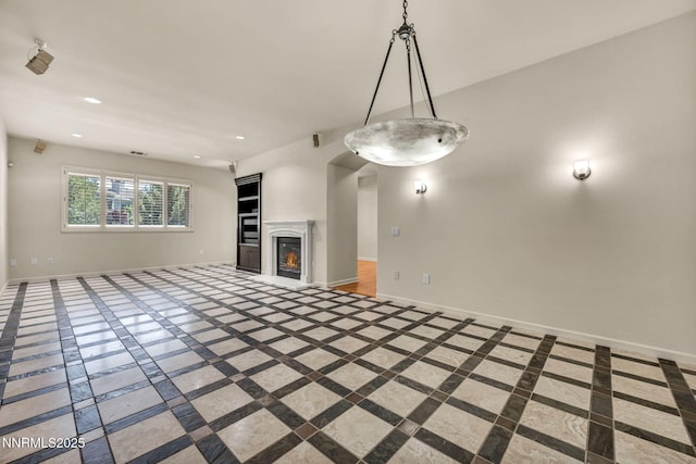 9900 Wilbur May Pkwy Apt 2801, Reno, NV 89521 - unfurnished living room with inlaid floor details, baseboards, recessed lighting, and a glass covered fireplace