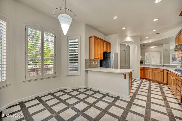 9900 Wilbur May Pkwy Apt 2801, Reno, NV 89521 - kitchen featuring freestanding refrigerator, inlaid floor details, a peninsula, baseboards, and recessed lighting