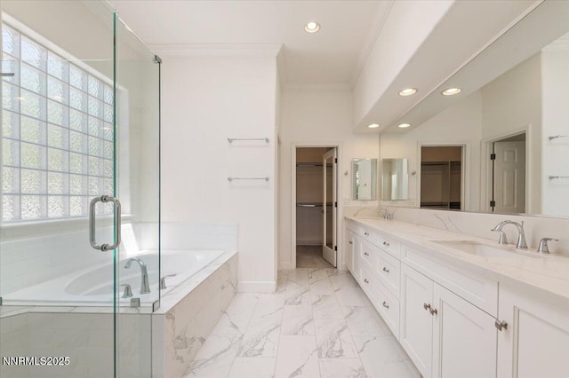 2728 Spirit Rock Trl, Reno, NV 89511 - bathroom with recessed lighting, crown molding, a garden tub, a walk in closet, and double vanity