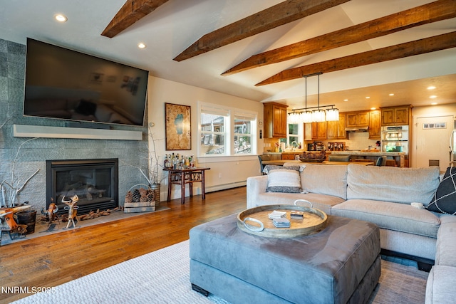 625 Freel Dr, Zephyr Cove, NV 89448 - living area with recessed lighting, wood finished floors, baseboard heating, and a large fireplace