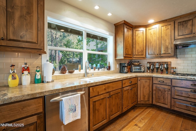 625 Freel Dr, Zephyr Cove, NV 89448 - kitchen with stainless steel appliances, decorative backsplash, brown cabinetry, light wood finished floors, and recessed lighting