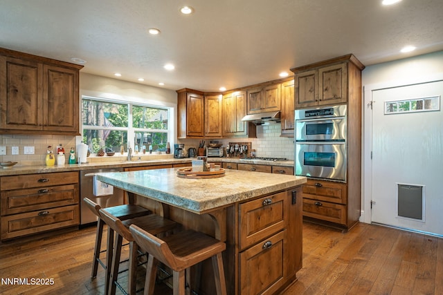 625 Freel Dr, Zephyr Cove, NV 89448 - kitchen featuring stainless steel appliances, recessed lighting, dark wood finished floors, and tasteful backsplash
