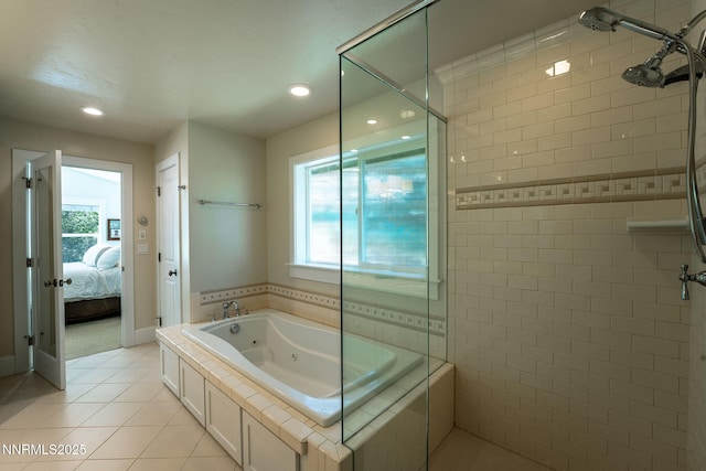 625 Freel Dr, Zephyr Cove, NV 89448 - ensuite bathroom with healthy amount of natural light, a tub with jets, tile patterned flooring, tiled shower, and recessed lighting
