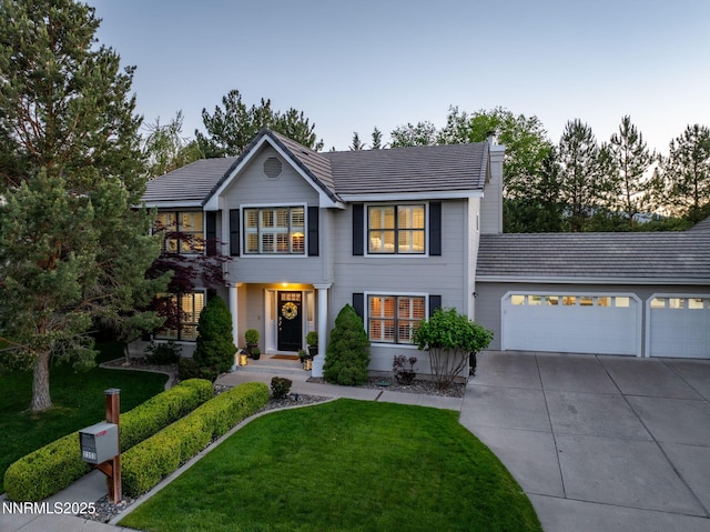 2353 Queen Anne Ct, Reno, NV 89509 - view of front of property featuring concrete driveway, a garage, and a front yard