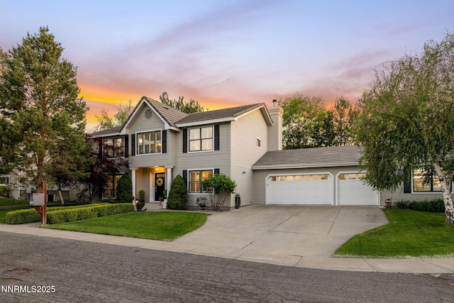 2353 Queen Anne Ct, Reno, NV 89509 - view of front of property featuring an attached garage, driveway, a lawn, and a chimney