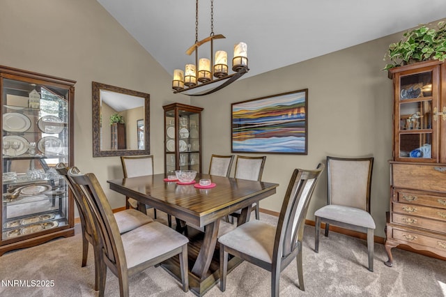 914 Jennifer St, Incline Village, NV 89451 - dining room featuring vaulted ceiling, light carpet, a chandelier, and baseboards