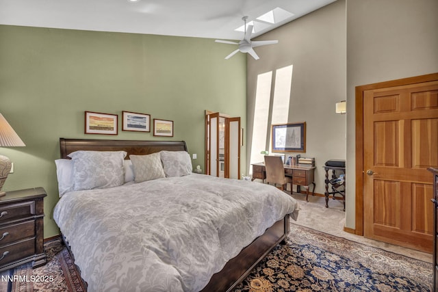 914 Jennifer St, Incline Village, NV 89451 - bedroom with high vaulted ceiling, a skylight, carpet, baseboards, and ceiling fan