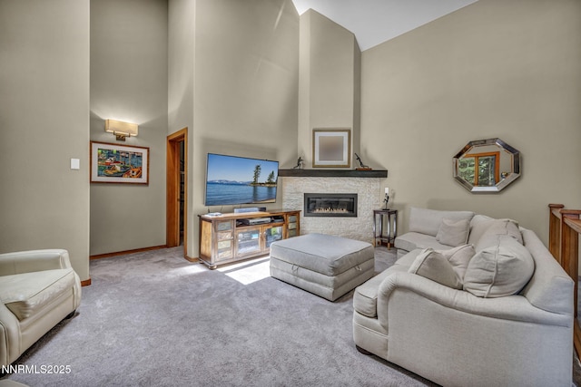 914 Jennifer St, Incline Village, NV 89451 - carpeted living room featuring a stone fireplace, baseboards, and high vaulted ceiling