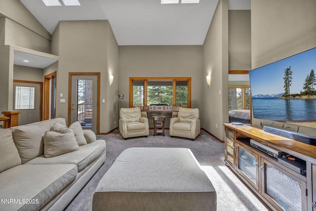 914 Jennifer St, Incline Village, NV 89451 - living room with high vaulted ceiling, healthy amount of natural light, a skylight, carpet, and baseboards