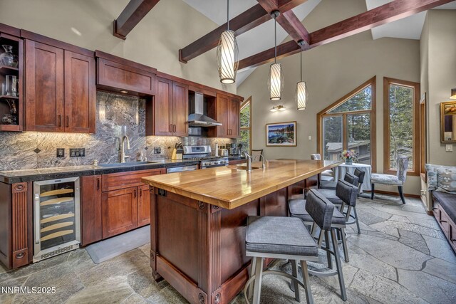 914 Jennifer St, Incline Village, NV 89451 - kitchen with beverage cooler, a sink, wall chimney exhaust hood, stone tile flooring, and high vaulted ceiling