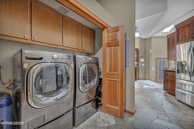 914 Jennifer St, Incline Village, NV 89451 - laundry room featuring stone tile floors, separate washer and dryer, cabinet space, and baseboards