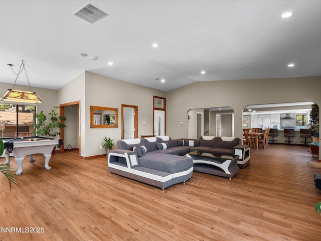 315 Paiute Dr, Zephyr Cove, NV 89448 - living room with billiards, light wood-style flooring, vaulted ceiling, recessed lighting, and arched walkways