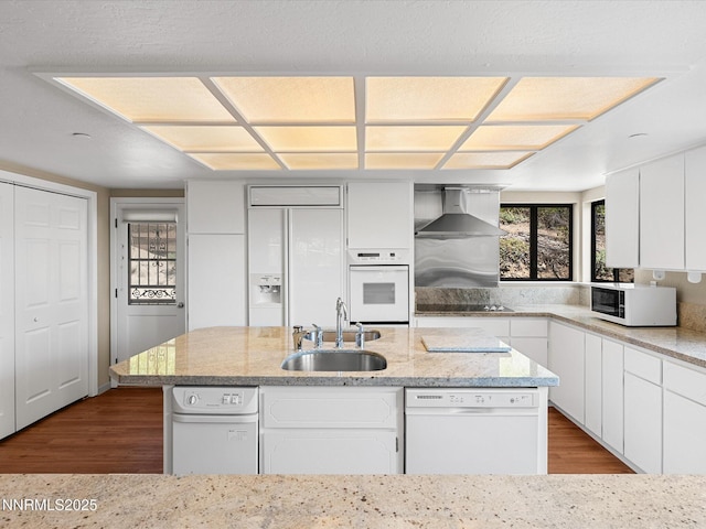315 Paiute Dr, Zephyr Cove, NV 89448 - kitchen with white appliances, wall chimney range hood, dark wood-type flooring, a center island, and white cabinetry