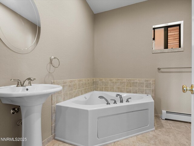 315 Paiute Dr, Zephyr Cove, NV 89448 - bathroom featuring a baseboard heating unit, a garden tub, and tile patterned floors