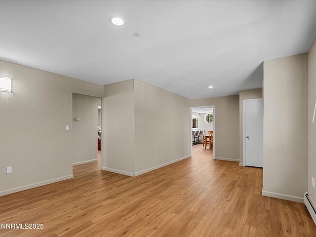315 Paiute Dr, Zephyr Cove, NV 89448 - unfurnished room featuring a baseboard heating unit, light wood-style flooring, and recessed lighting