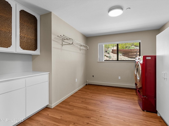 315 Paiute Dr, Zephyr Cove, NV 89448 - washroom featuring baseboard heating, light wood-style floors, cabinet space, and washer and dryer