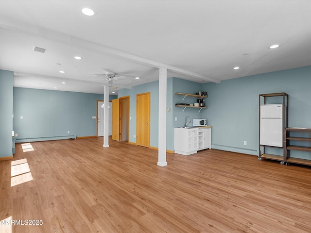 315 Paiute Dr, Zephyr Cove, NV 89448 - unfurnished living room with a baseboard radiator, recessed lighting, light wood-style flooring, and ceiling fan