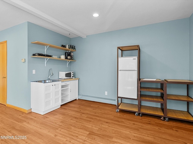 315 Paiute Dr, Zephyr Cove, NV 89448 - bar featuring a baseboard radiator, white appliances, light wood-style flooring, and recessed lighting
